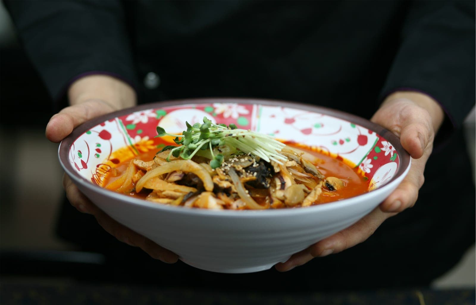 Warm jjambbong bowl served at DOYA JJAMBBONG for rainy day food in Ho Chi Minh