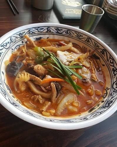Spicy Korean jjambbong noodles on a table for a rainy day meal